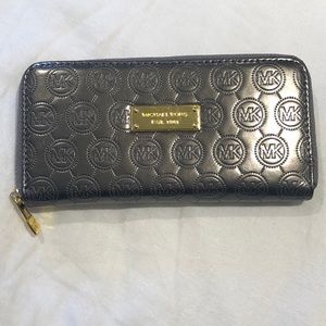 Silver metallic Micheal Kors large zip up wallet